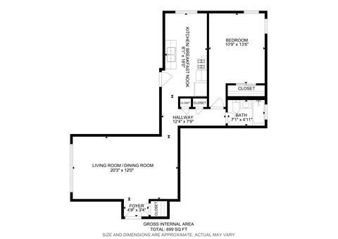 A floor plan of a small apartment with a living room, dining room, kitchen, and bathroom.